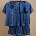 Couple silk pajama set displayed on hangers, featuring elegant blue silk fabric and stylish matching designs.